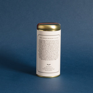 brewing instructions on gold tea tin, against blue background