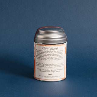 brewing instructions of silver tea tin with orange flower graphic against blue backdrop