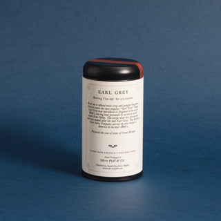 single black tin with brewing tips against a blue background