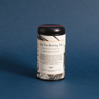 brewing instructions on black tea tin against blue background