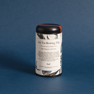 brewing instructions on black tea tin with black and white pattern