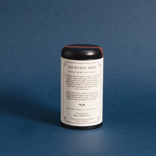 brewing instructions on backside of black tea tin with blue backdrop 