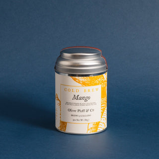 small silver tea tin with yellow design on label