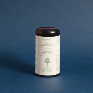 brewing instructions on backside on black tea tin with green dots and lines on the design label