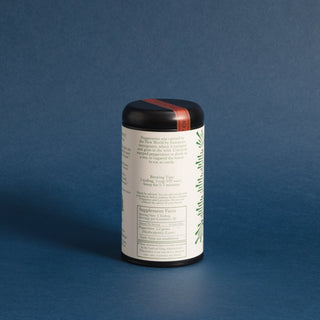 brewing instructions on backside on black tea tin with green dots and lines on the design label