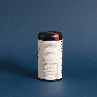 brewing instructions on black tea tin with dark purple pattern on label