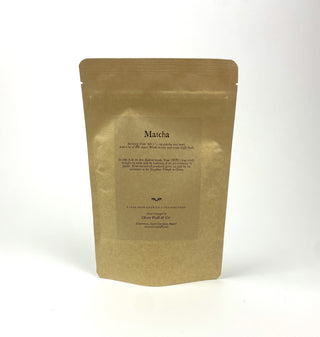 golden yellow tea pouch bag with loose leaf matcha inside