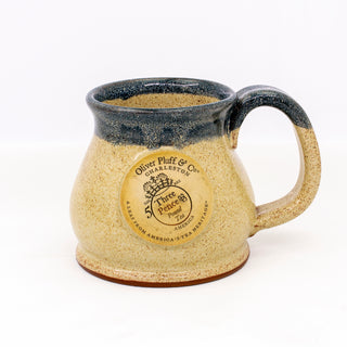 yellow & blue ceramic mug with O.P. logo