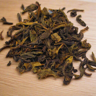 pile of loose leaf tea on wooden table