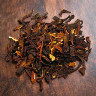 pile of loose leaf tea on wooden table