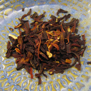 pile of loose leaf tea on blue and yellow plate