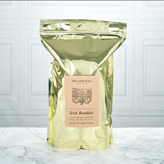 shiny gold tea bag pouch sitting on kitchen counter