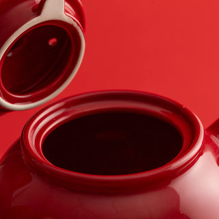 close up view of red tea pot