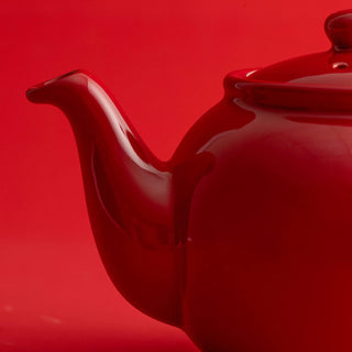 close up view of red tea pot