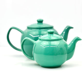 two green tea pots