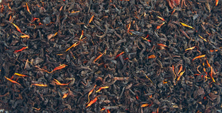 up close view of loose leaf teas, dark colors and some red