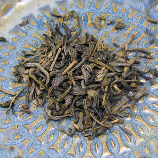 Green tea made from young leaves that are thinly rolled to have a long, twisted appearance that unfurls when brewed