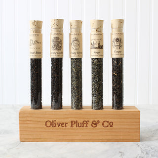 5 glass tubes filled with approx. 9-15g of loose tea each on wooden holder